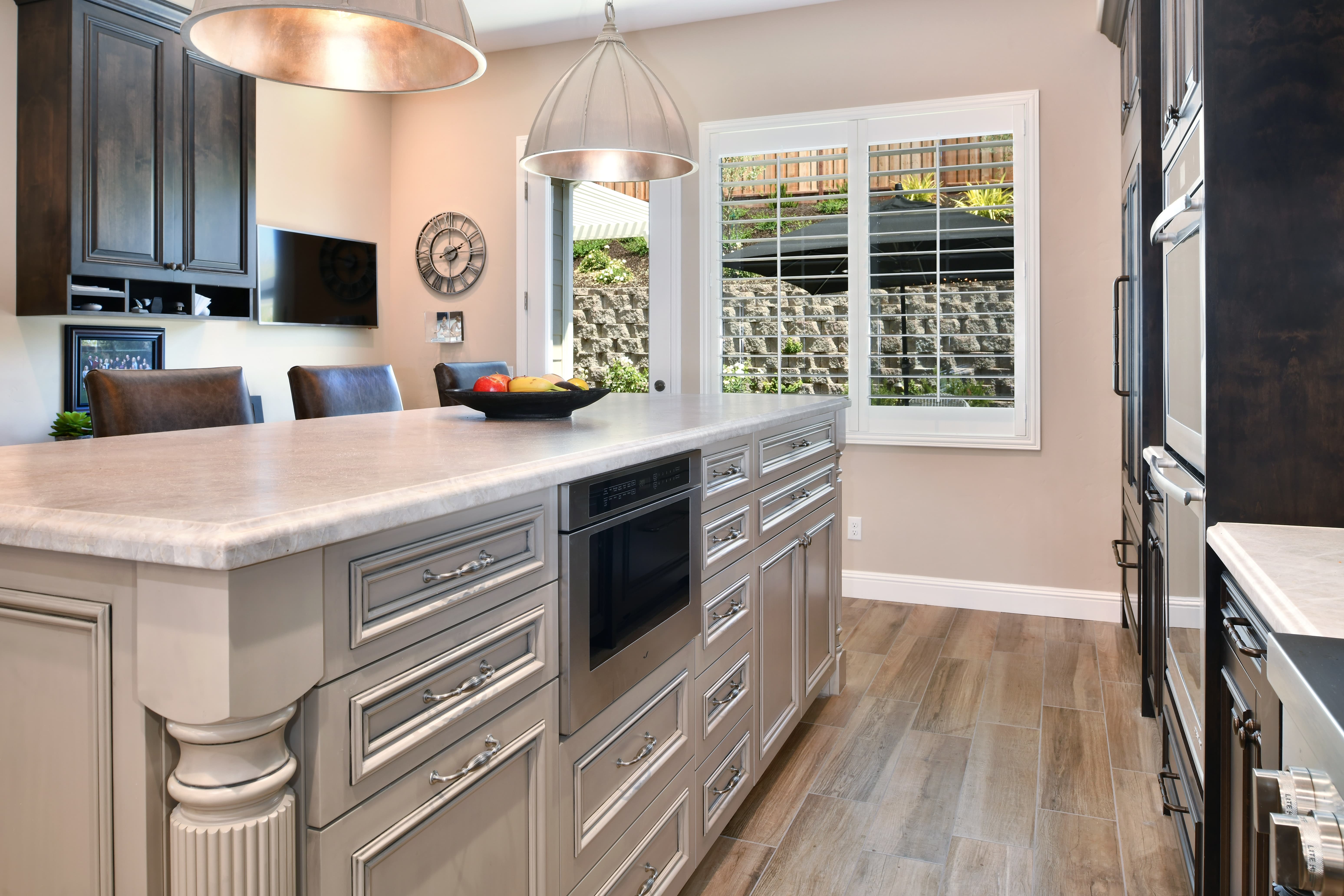 Wine Country kitchen with indoor-outdoor connection to covered patio